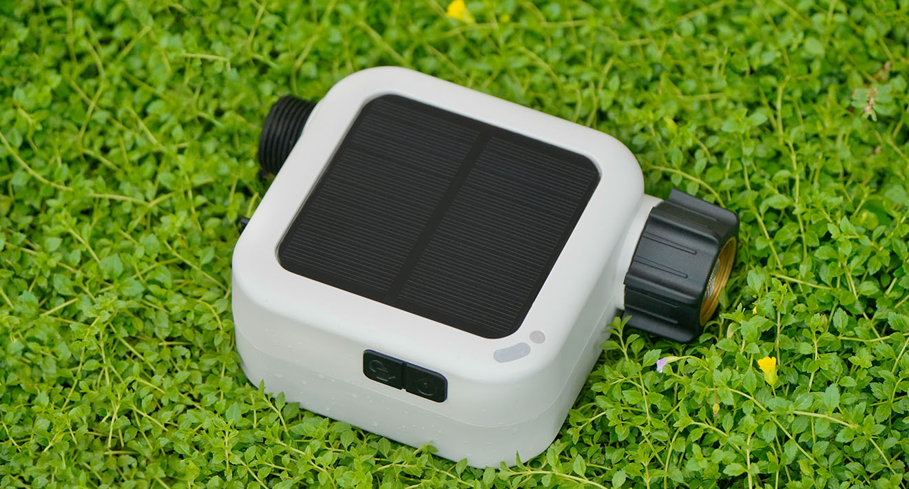 Pixie 2nd Gen product render showing the solar panel and hose connectors.