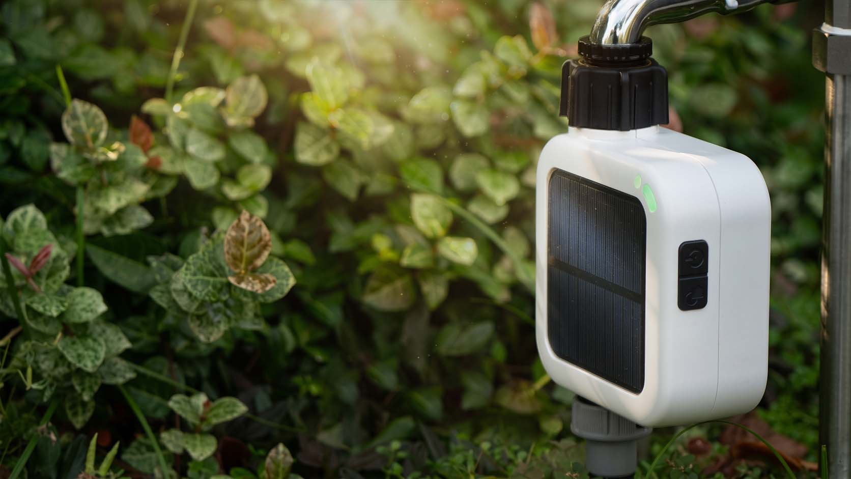 Pixie 2nd Gen charging by sunlight on a garden lawn.